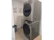 Modern laundry area features stacked washer and dryer for space-saving convenience at 945 Vegas Valley Dr, Las Vegas, NV 89109