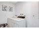 Clean, all-white laundry room is ready for use at 945 Vegas Valley Dr, Las Vegas, NV 89109