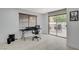 Bright office area features a sliding glass door, and neutral tiling at 945 Vegas Valley Dr, Las Vegas, NV 89109