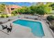 Inviting backyard pool with plenty of seating, landscaping and shade at 945 Vegas Valley Dr, Las Vegas, NV 89109