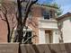 Two-story home featuring two levels and a small lawn at 9937 La Paca Ave, Las Vegas, NV 89117