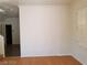 View of the living room showcasing hardwood floors and bright, shuttered windows at 9937 La Paca Ave, Las Vegas, NV 89117