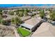 Aerial view showcasing a home with a covered patio and putting green at 10621 Tinta Ln, Las Vegas, NV 89144