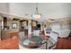 Spacious living space with a dining area, kitchenette, comfortable seating, and hardwood floors at 10621 Tinta Ln, Las Vegas, NV 89144