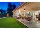 Charming covered patio with a fire pit and mini golf at 10621 Tinta Ln, Las Vegas, NV 89144