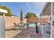 Relaxing backyard setting with a pool and comfortable patio furniture at 1104 Christopher View Ave, North Las Vegas, NV 89032