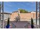 Private backyard area with a patio set surrounded by a brick patio and tidy foliage at 1104 Christopher View Ave, North Las Vegas, NV 89032