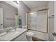 Bathroom features a golden-trimmed shower with a granite countertop sink at 1104 Christopher View Ave, North Las Vegas, NV 89032