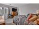 Comfortable bedroom features a large window and a mounted television at 1104 Christopher View Ave, North Las Vegas, NV 89032