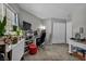 The room features a desk, shelving, plants, and carpeted floors at 1104 Christopher View Ave, North Las Vegas, NV 89032