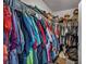 The closet is packed with assorted clothing items and storage shelves at 1104 Christopher View Ave, North Las Vegas, NV 89032