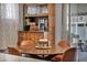 A cozy dining area featuring a unique table and a decorative hutch at 1104 Christopher View Ave, North Las Vegas, NV 89032