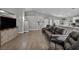 Spacious living room with recessed lighting, wood flooring, and neutral gray walls at 1104 Christopher View Ave, North Las Vegas, NV 89032