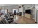 Spacious living room with recessed lighting, wood flooring, and neutral gray walls at 1104 Christopher View Ave, North Las Vegas, NV 89032