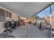 Covered patio area with outdoor kitchen, perfect for al fresco dining and relaxation at 1104 Christopher View Ave, North Las Vegas, NV 89032
