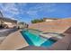 Stunning backyard featuring a sparkling pool, spa, and covered patio at 1104 Christopher View Ave, North Las Vegas, NV 89032