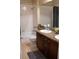 Well-lit bathroom featuring a shower-tub combo, vanity, and granite countertops at 11268 Corsica Mist Ave, Las Vegas, NV 89135