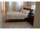 Relaxing bedroom featuring a comfortable bed with neutral bedding and warm, inviting colors at 11268 Corsica Mist Ave, Las Vegas, NV 89135