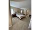 Bright and airy bedroom with a king-size bed, plantation shutters, and an ensuite bathroom at 11268 Corsica Mist Ave, Las Vegas, NV 89135