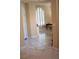 Elegant entryway with tile flooring, arched doorway and plantation shutters at 11268 Corsica Mist Ave, Las Vegas, NV 89135