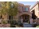 Charming two-story home featuring stone accents, covered porch and manicured landscaping at 11268 Corsica Mist Ave, Las Vegas, NV 89135
