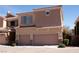 Exterior view showcases the two-story home with a two-car garage at 11268 Corsica Mist Ave, Las Vegas, NV 89135