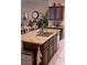 Kitchen island with a stainless steel sink and a granite countertop at 11268 Corsica Mist Ave, Las Vegas, NV 89135