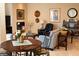 Comfortable living room with a fireplace, artwork, and decorative accents on display at 11268 Corsica Mist Ave, Las Vegas, NV 89135