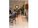 Open-concept living area with a large houseplant, breakfast bar, and neutral decor at 11268 Corsica Mist Ave, Las Vegas, NV 89135