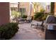 Relaxing outdoor living space with BBQ, patio furniture, and mature landscaping at 11268 Corsica Mist Ave, Las Vegas, NV 89135