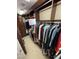 Organized walk-in closet featuring custom shelving and ample storage for clothing at 11268 Corsica Mist Ave, Las Vegas, NV 89135