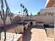 Outdoor kitchen featuring a built-in BBQ grill, sink, prep areas, and block wall for privacy at 1301 Misty View Ct, North Las Vegas, NV 89031