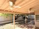 A covered patio features ceiling fans and opens to a backyard with a decorative wall and mature trees at 1301 Misty View Ct, North Las Vegas, NV 89031