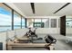A bright exercise room with lake views and state of the art equipment including a pilates machine at 1572 Pleasant Bay Ct, Henderson, NV 89011