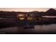 Beautiful modern waterfront home featuring a private dock with seating area for relaxing at 1572 Pleasant Bay Ct, Henderson, NV 89011