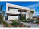 Modern home exterior with clean lines, desert landscaping, and a private courtyard at 1572 Pleasant Bay Ct, Henderson, NV 89011