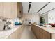 Sleek modern kitchen with stainless steel appliances, custom wood cabinets and large countertop space at 1572 Pleasant Bay Ct, Henderson, NV 89011