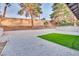 Large backyard with gravel yard, low-maintenance turf area, and block wall at 163 Spinnaker Dr, Henderson, NV 89015