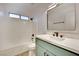 Updated bathroom features stylish vanity with modern fixtures, a tub and shower combo, and bright lighting at 163 Spinnaker Dr, Henderson, NV 89015