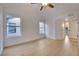 Spacious bedroom with light wood flooring, white walls, and multiple windows offering ample natural light at 163 Spinnaker Dr, Henderson, NV 89015