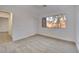 Bright bedroom with a large window, neutral carpet and fresh, white paint at 163 Spinnaker Dr, Henderson, NV 89015