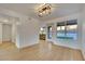 Bright dining area with backyard access and modern light fixture at 163 Spinnaker Dr, Henderson, NV 89015