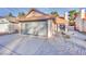 Charming single-story home with a two-car garage and low maintenance rock landscaping at 163 Spinnaker Dr, Henderson, NV 89015