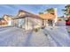 Charming single-story home with well-maintained gravel yard and attached two-car garage at 163 Spinnaker Dr, Henderson, NV 89015