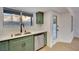 Updated kitchen featuring stainless steel appliances, quartz countertops, and a garden view at 163 Spinnaker Dr, Henderson, NV 89015