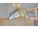Spacious living room featuring a staircase with black railing and lots of natural light at 163 Spinnaker Dr, Henderson, NV 89015