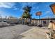Backyard featuring a basketball hoop, large tree, and concrete pavers at 1808 Walnut Ave, Las Vegas, NV 89101