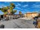 Backyard featuring a basketball hoop, large tree, and concrete pavers at 1808 Walnut Ave, Las Vegas, NV 89101