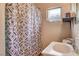 Standard bathroom featuring a shower with curtain and small vanity sink at 1808 Walnut Ave, Las Vegas, NV 89101