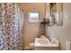 Standard bathroom featuring a shower with curtain and small vanity sink at 1808 Walnut Ave, Las Vegas, NV 89101
